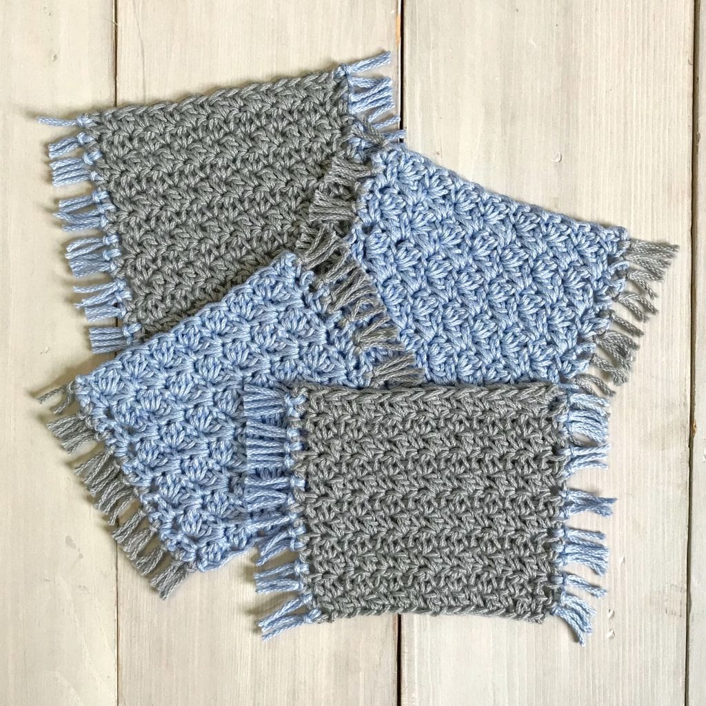 set of 4 crochet coasters in blue and gray