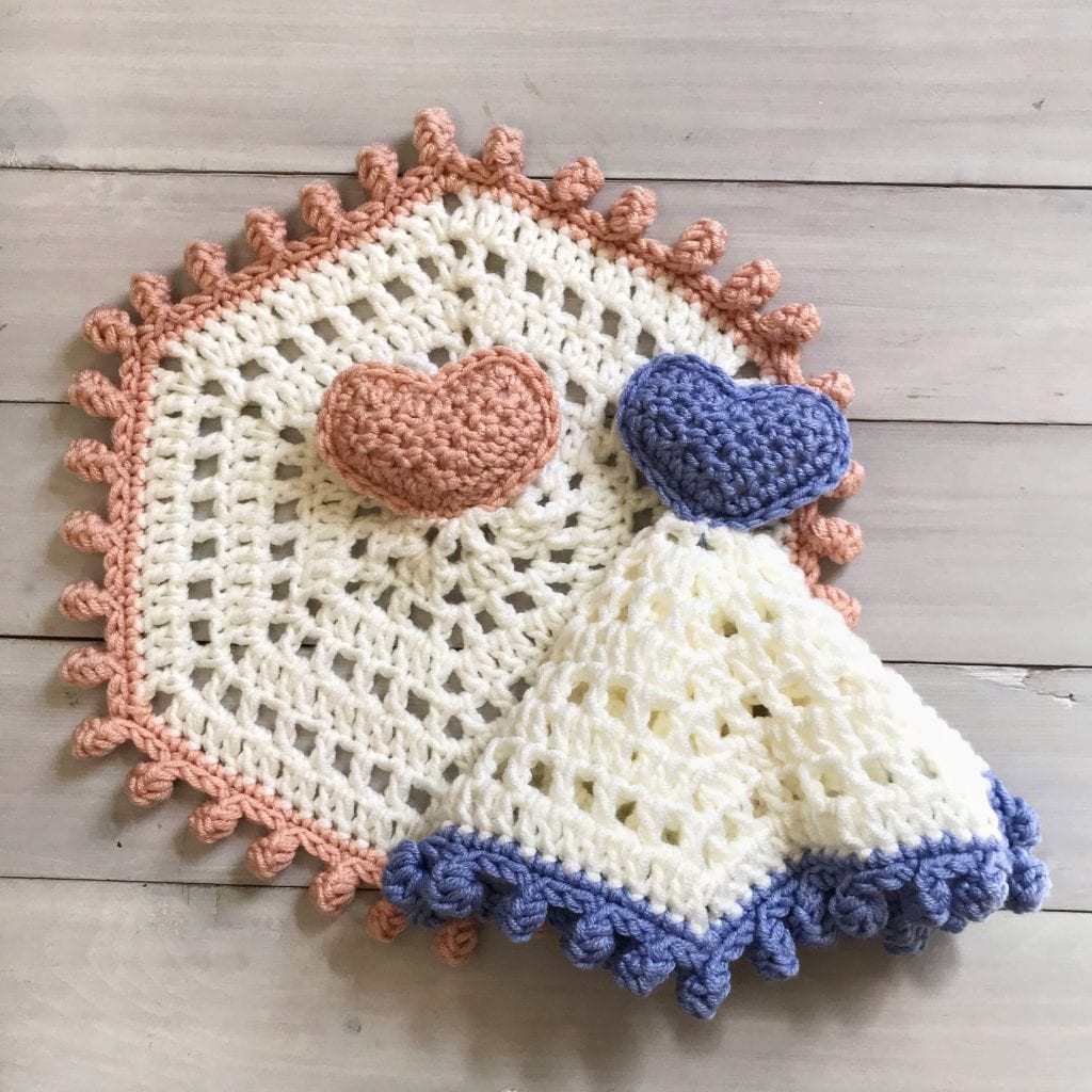 2 crochet heart lovies laid flat